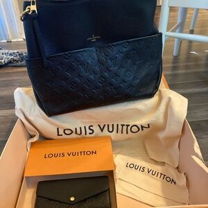 A black Louis Vuitton purse, and the matching wallet